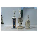 Three Golf-Themed Trophies with Metal and Stone Ba