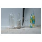 Four Glass Bottles Including a Painted Geometric D