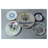 Five Decorative Plates Featuring Various Designs
