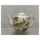 Porcelain Teapot with Lotus Motif and Chinese Call