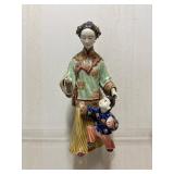 Hand-Painted Porcelain Figurine of a Woman and Chi