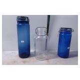 Two Blue Glass Canisters and One Clear Glass 'Ball