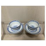 Blue and White Porcelain Tea Cups with Matching Sa