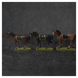 Three Painted Metal Horse Figurines with Saddle De