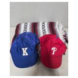 Two Adjustable Baseball Caps and a Striped Blanket
