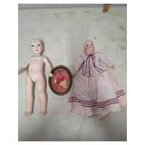 Two Bisque Dolls with Accessories and Wooden Oval