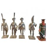 Four Silver-Colored Metal Soldier Figurines and On