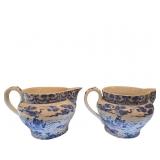 Two Blue and White Ceramic Pitchers with Asian Lan