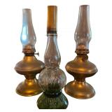 Three Oil Lamps: Two Brass and One Clear Glass wit