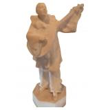 Carved Marble Sculpture of a Musician Holding a St