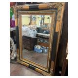 Ornately Carved Wood-Framed Mirror with Gilt Accen