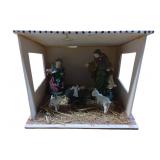 Small Nativity Scene with Ceramic Figurines in a W