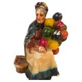 Painted Chalkware Figurine of Seated Woman with Ba