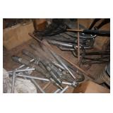 Assorted exhaust pipes and three motorcycle wheels
