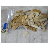 Small Bag of Carved Bone Pieces