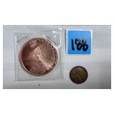 1 oz copper coin and vintage penny