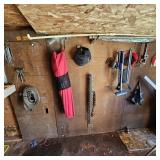 Everything hanging on right side of shed wall