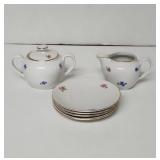 Vintage Bavaria sugar , creamer and 4 saucers .