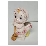 Vintage baby with broom planter pot