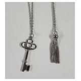 Silver tone key and hassle on long chains