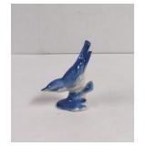 Vintage ceramic Blue Bird sitting on bench