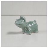 Teal glazed pig ceramic figurine