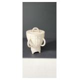Lidded ceramic vase featuring a textured, white