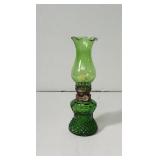 Vintage green glass oil lamp with a pressed