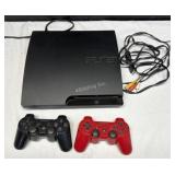 PS3 PlayStation w/ 2 controllers, AV Cables - L