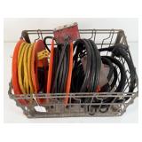 Group of Extension Cords In a Metal Wire Basket