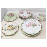 STACK OF COLLECTABLE FLORAL PLATES