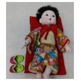VINTAGE CERAMIC ASIAN DOLL ON SLEEPING MAT 10'