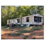 14'x66' mobile home set up in park - fixer-upper