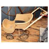 ANTIQUE METAL AND WICKER STROLLER