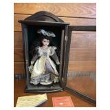 PORCELAIN DOLL IN WOODEN CASE