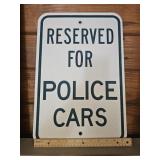 METAL RESERVED FOR POLICE CARS SIGN