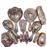 Several antique silver grooming kits