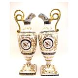Twin porcelain pitchers, gold and blue.