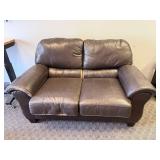 Leather-like love seat.  This is banged up a bit.