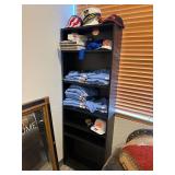 Office cabinet with contents of t-shirts and hats