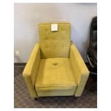 Yellow arm chair, has hole in fabric.
