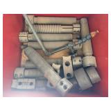 Red shelf and contents including lathe parts.