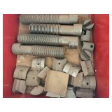 Red shelf and contents including lathe parts.