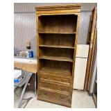 Wooden bookshelf with enclosed cabinet underneath