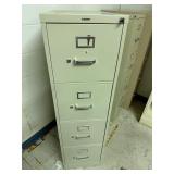 Brown metal file cabinet with key