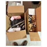 Two boxes of pegboard hooks