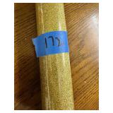 Roll of gold glitter, wrapping paper