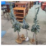 Three Decorative Snow-Covered Trees