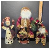 Three Santa Claus Figurines