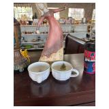 A lady dancing and two Christmas coffee mugs